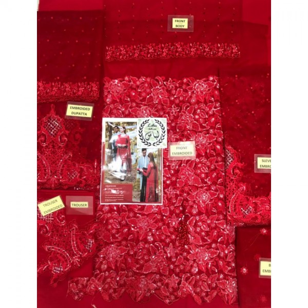 Beautiful red embroidered dress in net fabric Buyon.pk